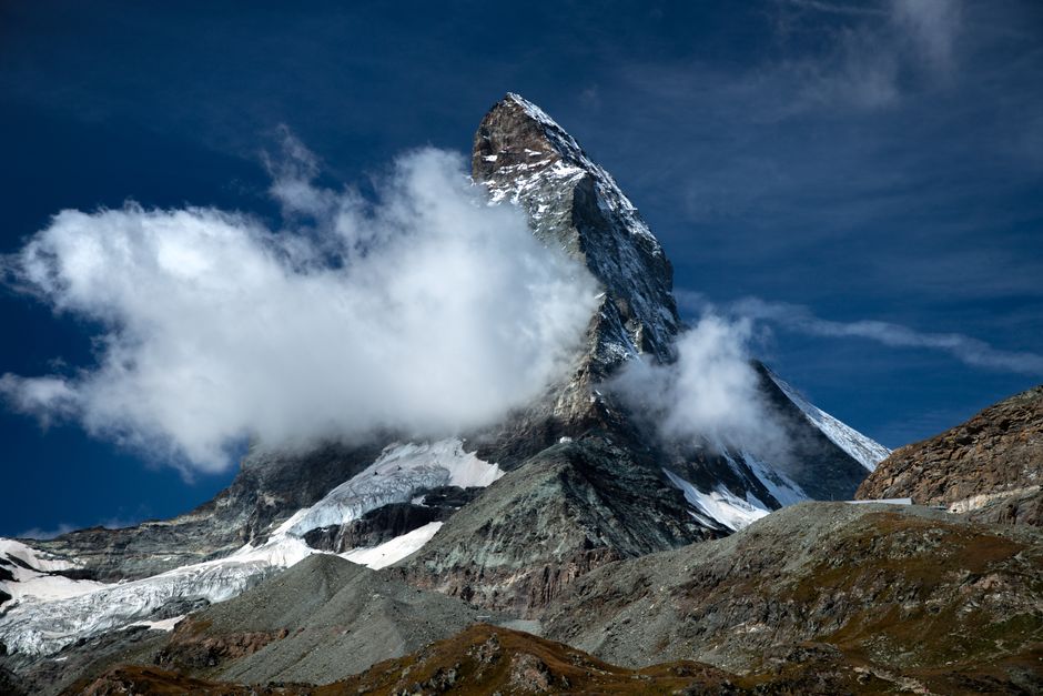 Stunning image of the iconic Matterhorn mountain with cloud formations in Zermatt, Switzerland.