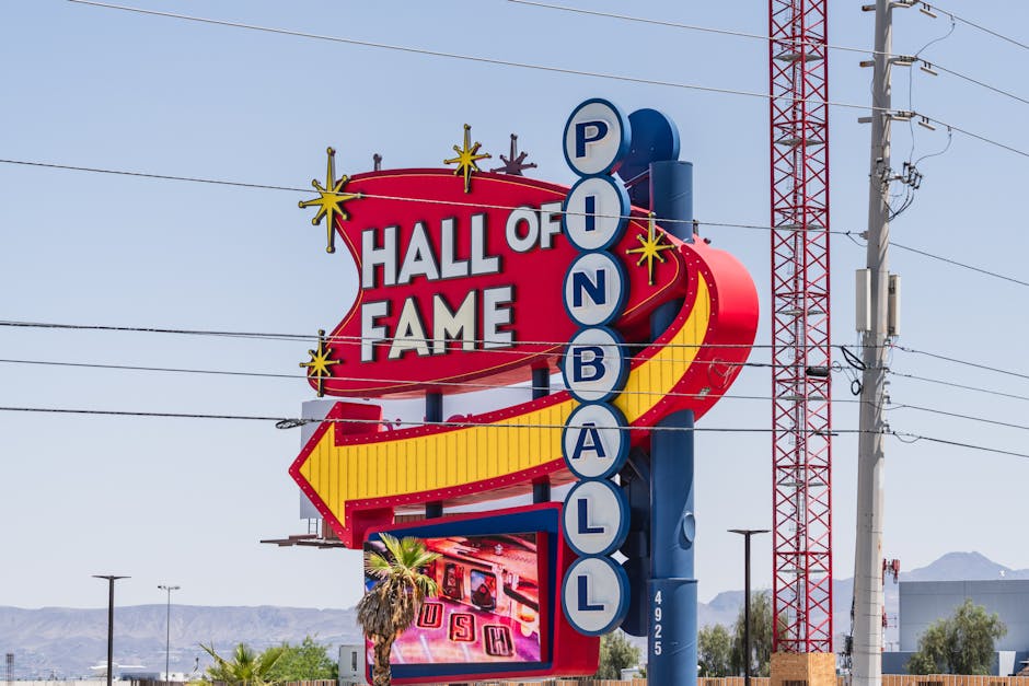 Vibrant sign of the Pinball Hall of Fame in Las Vegas, Nevada, captured outdoors in daylight.