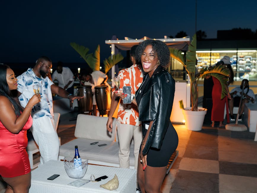 Lively gathering at night with friends celebrating outdoors in Lisbon, Portugal.